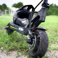 Load image into Gallery viewer, Mantis 40 MPH electric scooter parked with a helmet resting on the deck
